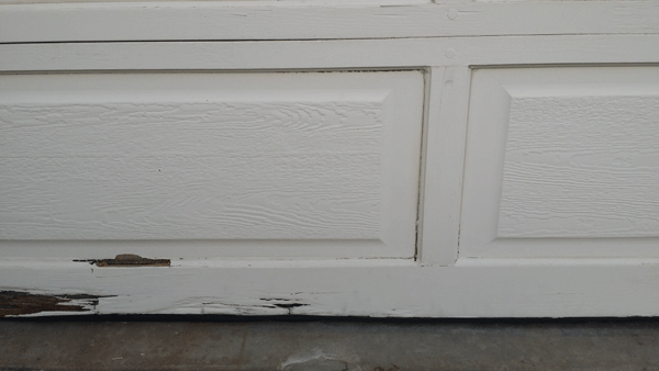 sectional garage door wood rot