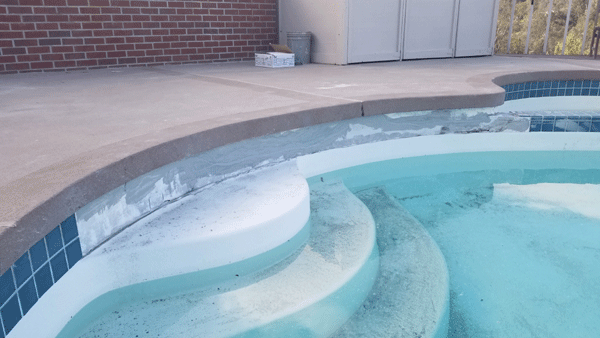 during settling damage to pool tile repair